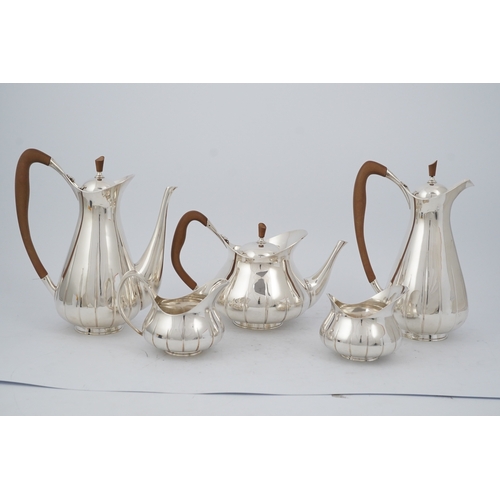 89 - A stylish 1960's Asprey & Co silver five piece tea and coffee service, of pyrifom, comprising a coff... 