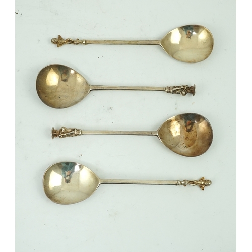 9 - Four cased 18th century silver spoons, two apostle spoons, one by Elizabeth Tookey, circa 1760, the ... 