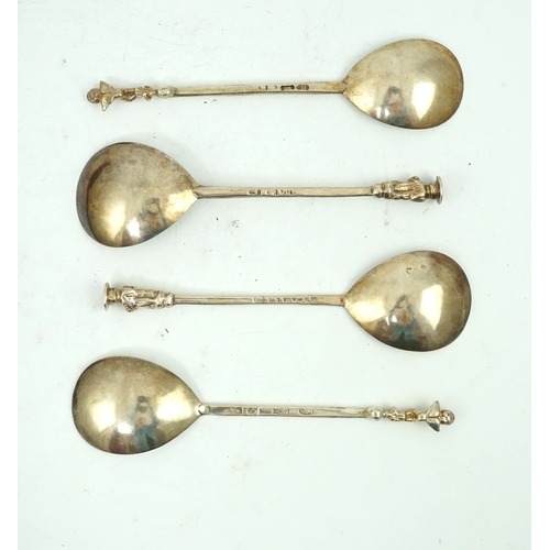 9 - Four cased 18th century silver spoons, two apostle spoons, one by Elizabeth Tookey, circa 1760, the ... 