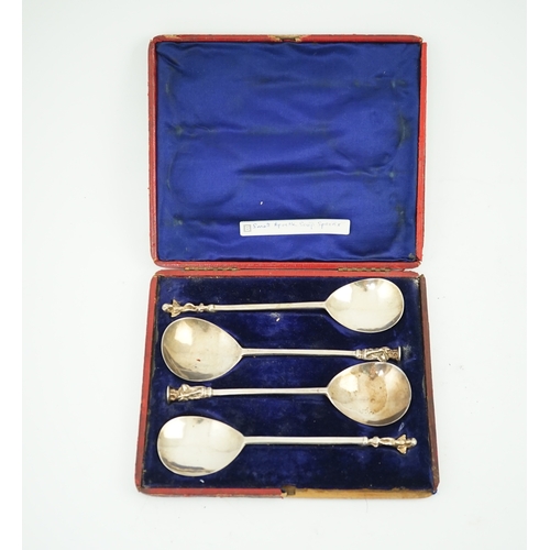 9 - Four cased 18th century silver spoons, two apostle spoons, one by Elizabeth Tookey, circa 1760, the ... 