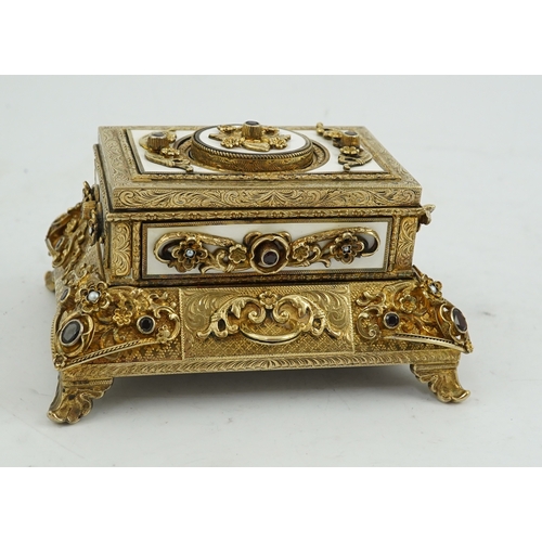 91 - A late Karl Griesbaum Model 17 silver gilt, white enamel, garnet and cultured pearl set automaton si... 