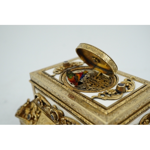 91 - A late Karl Griesbaum Model 17 silver gilt, white enamel, garnet and cultured pearl set automaton si... 