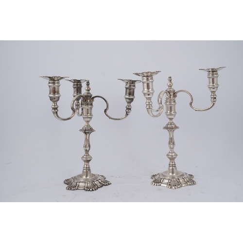 96 - A pair of Elizabeth II cast silver three branch, three light candelabra, by J.B. Chatterley & Sons L... 