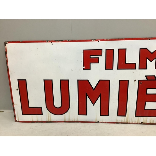 1001 - A large vintage French enamel advertising sign 'Film Lumière', width 246cm, height 95cm. Condition -... 