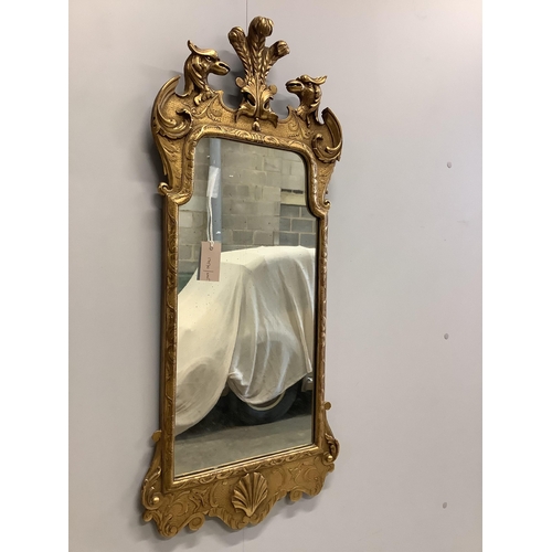 1013 - A George II style carved giltwood wall mirror with eagle surmount, width 40cm, 96cm high. Condition ... 