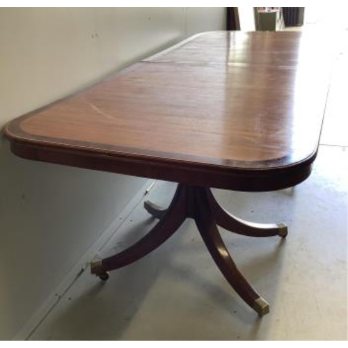 1021 - A reproduction mahogany twin pillar extending dining table, extended 300cm, two spare leaves, depth ... 