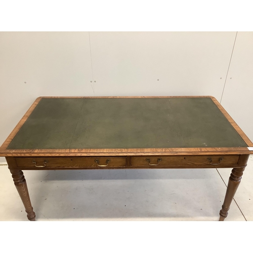 1026 - A reproduction Victorian style oak two drawer writing table, width 160cm, depth 84cm, height 76cm. C... 