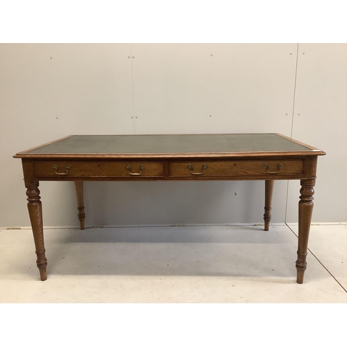 1026 - A reproduction Victorian style oak two drawer writing table, width 160cm, depth 84cm, height 76cm. C... 