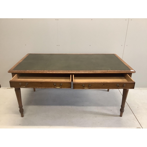 1026 - A reproduction Victorian style oak two drawer writing table, width 160cm, depth 84cm, height 76cm. C... 