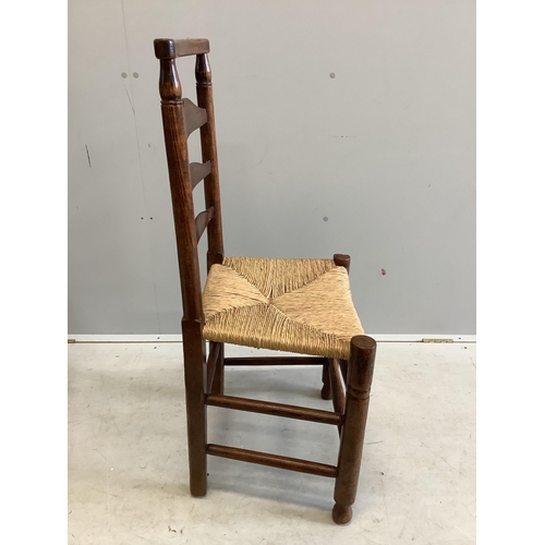 1094 - A set of four 19th century ash ladderback rush seat dining chairs. Condition - fair