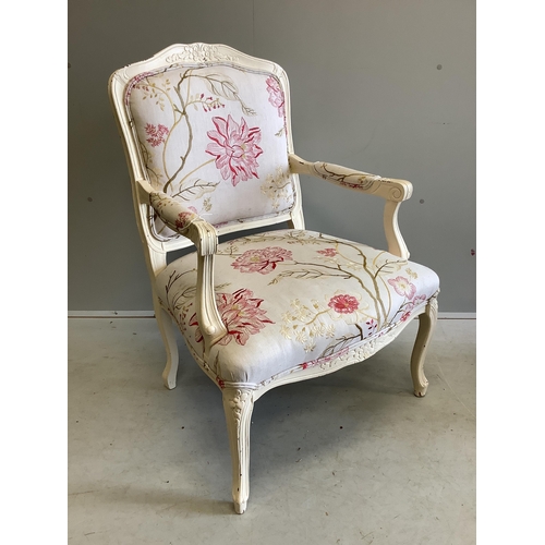 1095 - A Louis XVI style elbow chair and associated footstool upholstered in Voyage? fabric, chair width 65... 