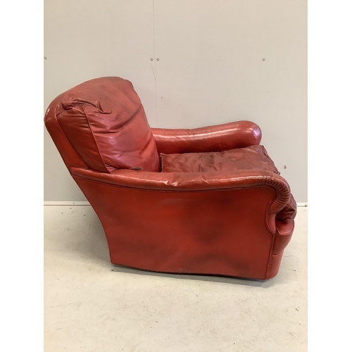 1099 - An Art Deco red leather club armchair, width 75cm, depth 90cm, height 80cm. Condition - poor to fair... 