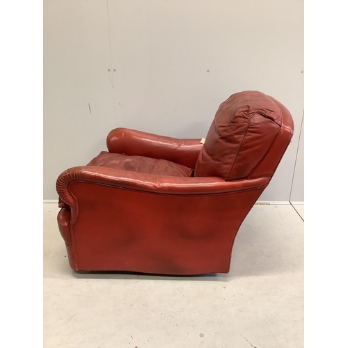 1099 - An Art Deco red leather club armchair, width 75cm, depth 90cm, height 80cm. Condition - poor to fair... 