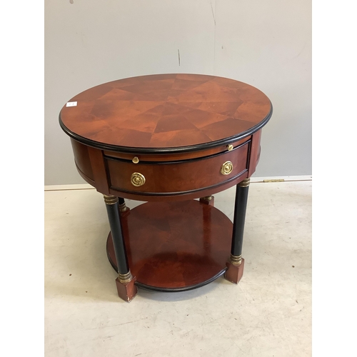 1107 - A pair of French Empire style mahogany and ebonised two tier circular tables, diameter 65cm, height ... 