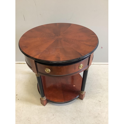 1107 - A pair of French Empire style mahogany and ebonised two tier circular tables, diameter 65cm, height ... 