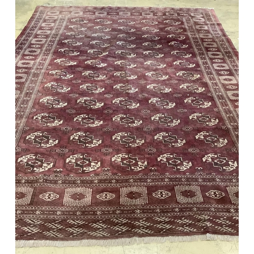 1115 - An antique Bokhara carpet, 384 x 286cm. Condition - fair