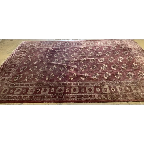 1115 - An antique Bokhara carpet, 384 x 286cm. Condition - fair