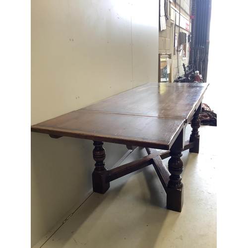 1128 - An 18th century style rectangular oak draw leaf refectory dining table, width 244cm extended, depth ... 