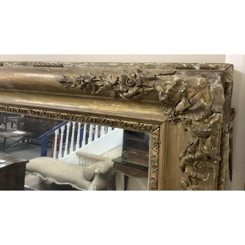 1135 - A large Victorian rectangular giltwood and composition overmantel mirror, width 137cm, height 178cm.... 