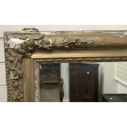 1135 - A large Victorian rectangular giltwood and composition overmantel mirror, width 137cm, height 178cm.... 