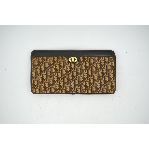 1263 - A vintage Dior brown cloth and leather trim monogram clutch bag