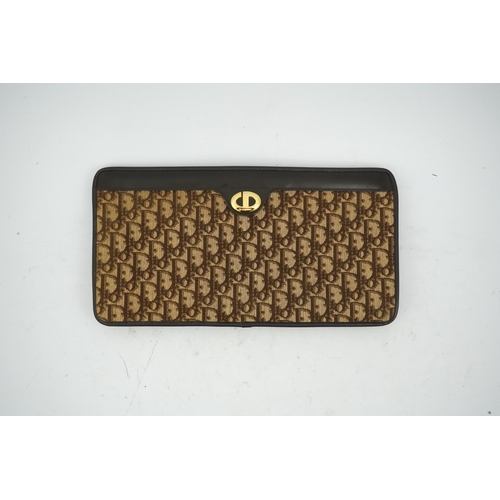 1263 - A vintage Dior brown cloth and leather trim monogram clutch bag