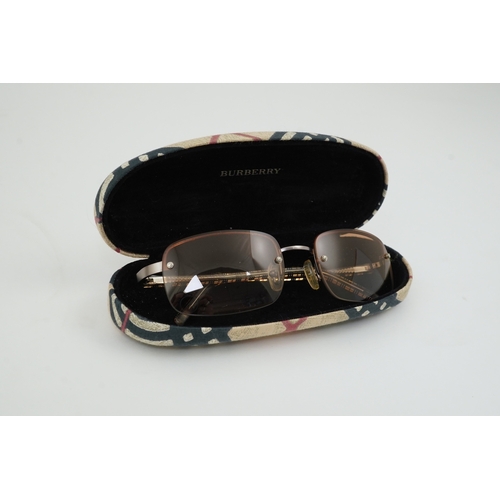 1264 - A Burberry brown tartan scarf, sunglasses with case and wallet with original box.