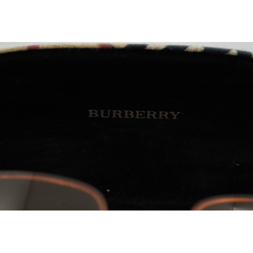 1264 - A Burberry brown tartan scarf, sunglasses with case and wallet with original box.