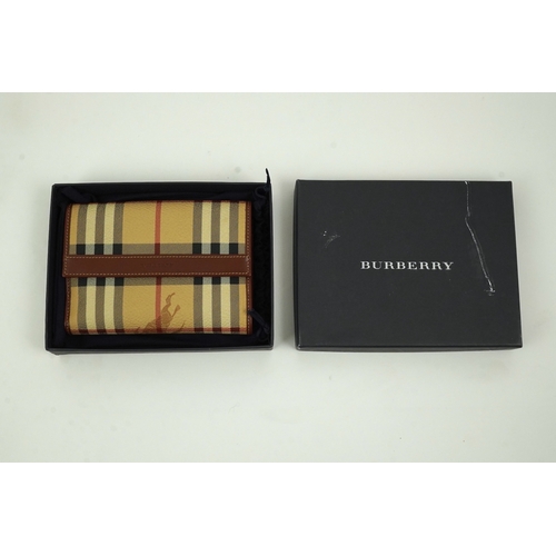 1264 - A Burberry brown tartan scarf, sunglasses with case and wallet with original box.