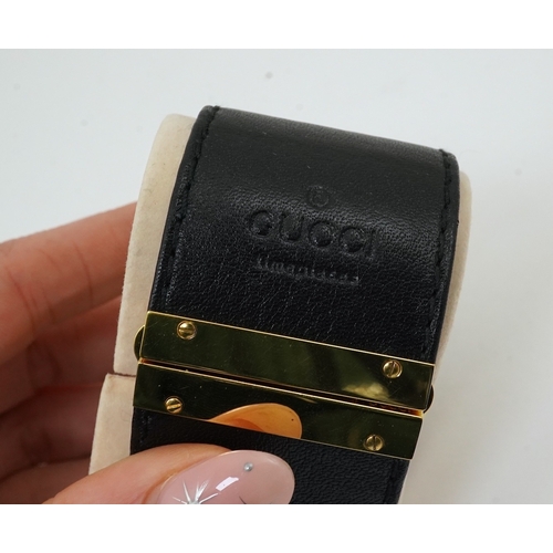 1284 - A lady's Gucci watch with wide leather strap, with box and papers.