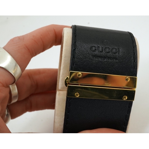 1284 - A lady's Gucci watch with wide leather strap, with box and papers.