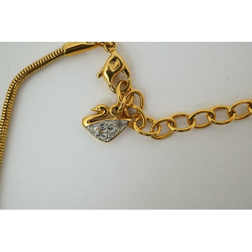 1287 - A Swarovski vintage cross necklace and ring.