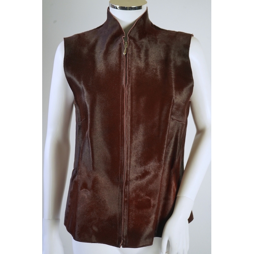 1294 - A lady's Jaeger brown ponyskin gilet with burgundy satin lining. UK 12-14