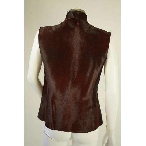 1294 - A lady's Jaeger brown ponyskin gilet with burgundy satin lining. UK 12-14