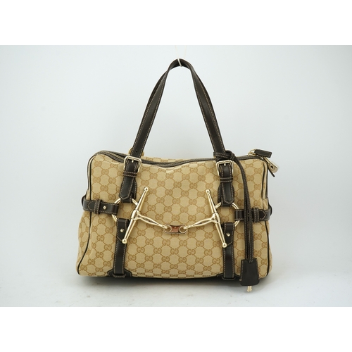 1301 - A vintage Gucci GG Classic Monogram Horsebit Shoulder Bag with original dust bag.