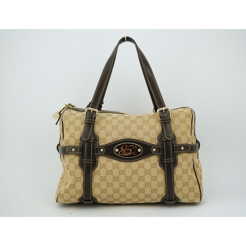 1301 - A vintage Gucci GG Classic Monogram Horsebit Shoulder Bag with original dust bag.