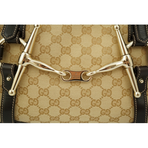 1301 - A vintage Gucci GG Classic Monogram Horsebit Shoulder Bag with original dust bag.