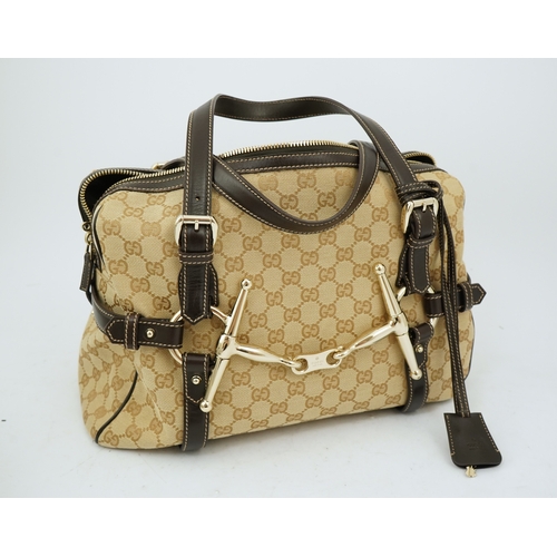 1301 - A vintage Gucci GG Classic Monogram Horsebit Shoulder Bag with original dust bag.