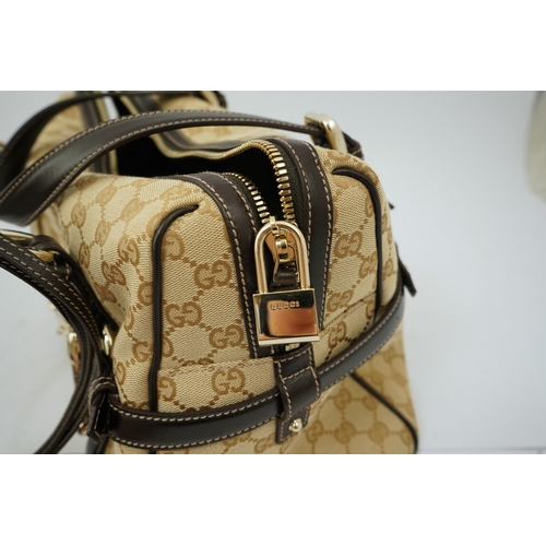 1301 - A vintage Gucci GG Classic Monogram Horsebit Shoulder Bag with original dust bag.