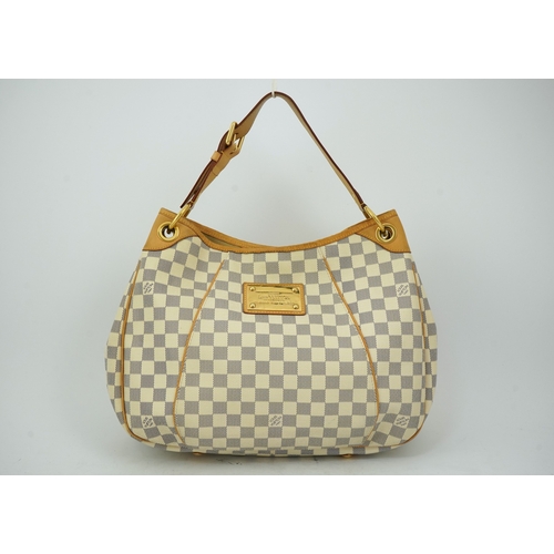 1303 - A Louis Vuitton handbag made from Damier Azur canvas with natural cowhide trim, with original dust b... 