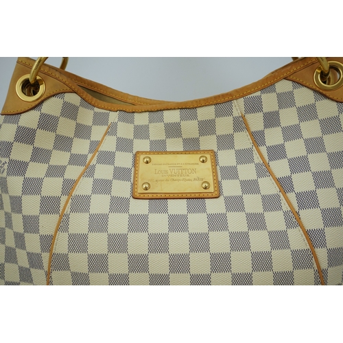 1303 - A Louis Vuitton handbag made from Damier Azur canvas with natural cowhide trim, with original dust b... 