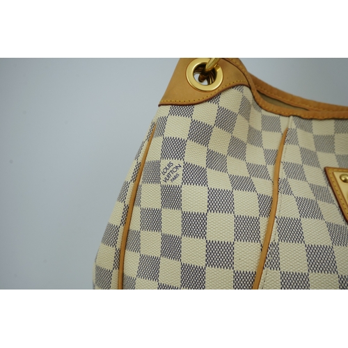 1303 - A Louis Vuitton handbag made from Damier Azur canvas with natural cowhide trim, with original dust b... 