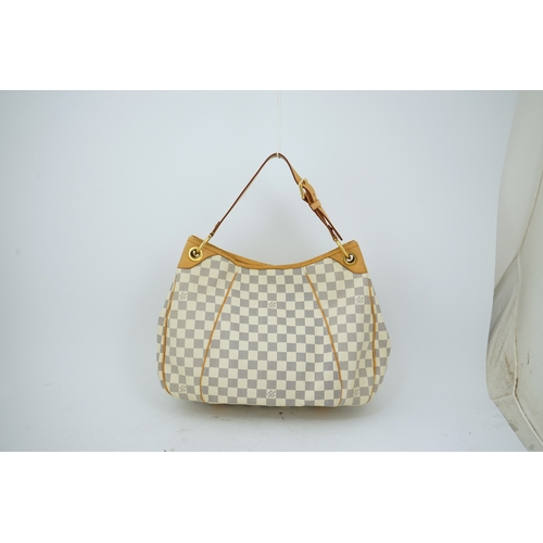 1303 - A Louis Vuitton handbag made from Damier Azur canvas with natural cowhide trim, with original dust b... 