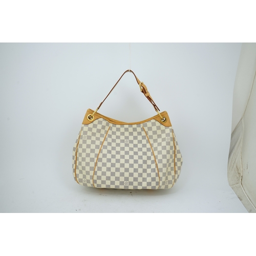 1303 - A Louis Vuitton handbag made from Damier Azur canvas with natural cowhide trim, with original dust b... 