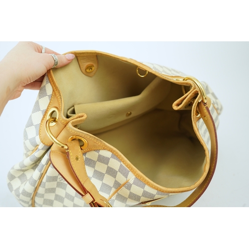 1303 - A Louis Vuitton handbag made from Damier Azur canvas with natural cowhide trim, with original dust b... 