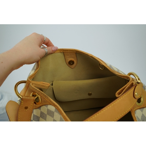 1303 - A Louis Vuitton handbag made from Damier Azur canvas with natural cowhide trim, with original dust b... 