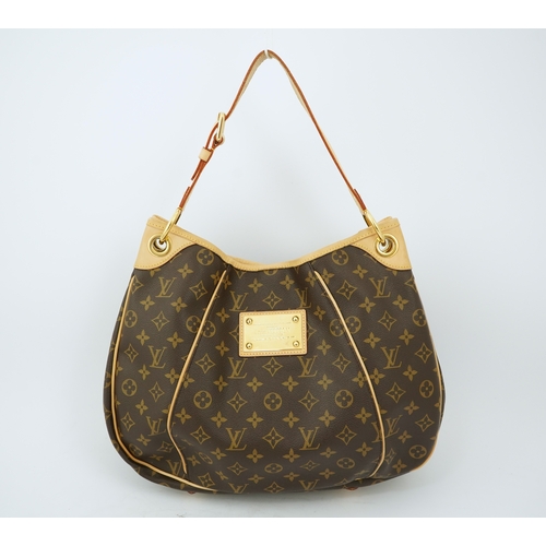 1305 - A Louis Vuitton brown monogram canvas with natural cowhide trim and gold-toned hardware, with origin... 