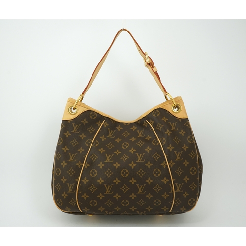 1305 - A Louis Vuitton brown monogram canvas with natural cowhide trim and gold-toned hardware, with origin... 