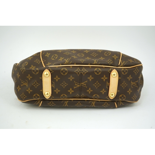 1305 - A Louis Vuitton brown monogram canvas with natural cowhide trim and gold-toned hardware, with origin... 