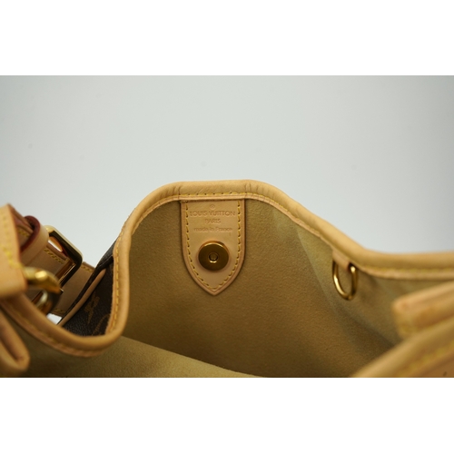 1305 - A Louis Vuitton brown monogram canvas with natural cowhide trim and gold-toned hardware, with origin... 